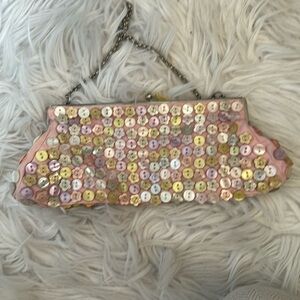 Pink clutch with pastel buttons